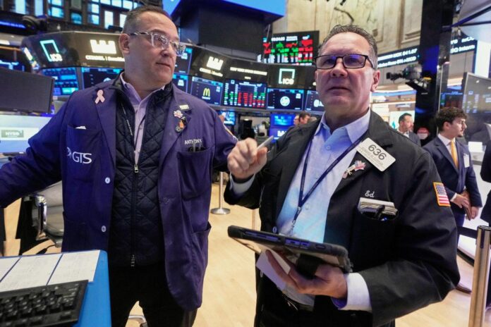 US stocks slip in morning trading as more companies report their results