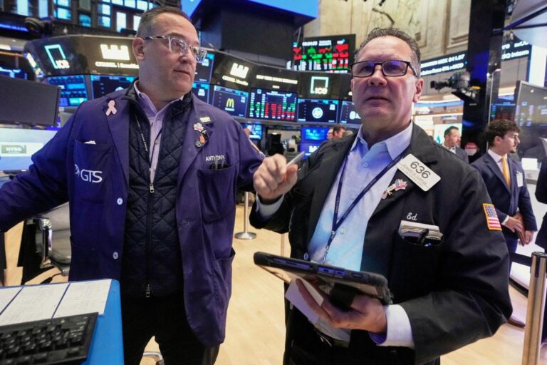 US stocks slip in morning trading as more companies report their results