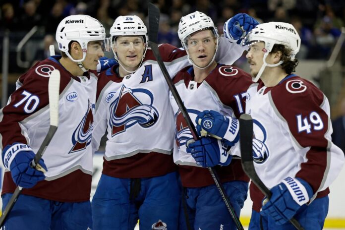 MacKinnon scores twice as the Avalanche beat the Rangers 3-2 in overtime