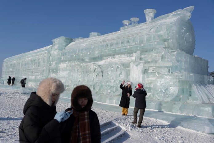 Harbin ice festival draws sculptors and spectators to northern China, in photos