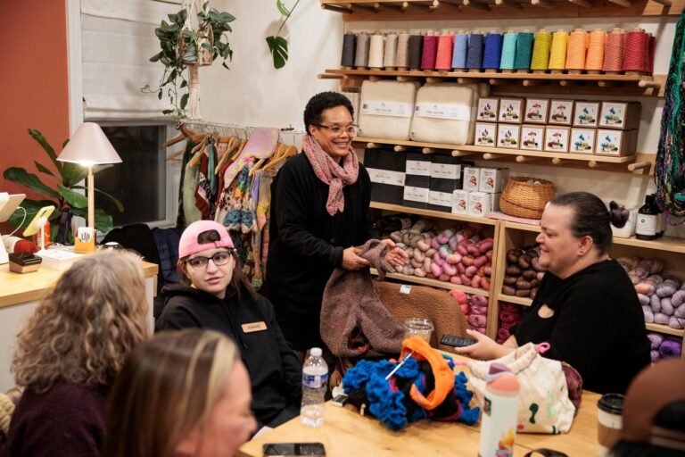 In ‘Melt the ICE’ wool caps, a red-tasseled symbol of resistance comes from Minneapolis to Philadelphia